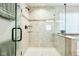 Close up of the frameless glass-enclosed shower with tiled walls at 4204 Omaha Dr, Bargersville, IN 46106