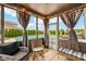 Enclosed sunroom with wicker furniture, string lights, curtains, and a beautiful view of the swimming pool at 4204 Omaha Dr, Bargersville, IN 46106