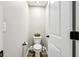 Small toilet room with plank flooring and a toilet paper holder at 4204 Omaha Dr, Bargersville, IN 46106