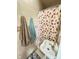 This bathroom features patterned tiles and a strawberry themed shower curtain at 424 S Parker Ave, Indianapolis, IN 46201