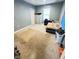 This bedroom features stained carpets and blue walls at 424 S Parker Ave, Indianapolis, IN 46201