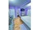 This bedroom features hardwood floors, purple walls, and silver furnishings at 424 S Parker Ave, Indianapolis, IN 46201