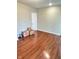 Bedroom showcasing gleaming hardwood floors with a door and some moving boxes at 424 S Parker Ave, Indianapolis, IN 46201