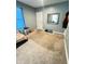 Bedroom with a mirror and stained carpet at 424 S Parker Ave, Indianapolis, IN 46201