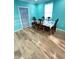 Dining room with wood floors, a table, and access to additional rooms at 424 S Parker Ave, Indianapolis, IN 46201