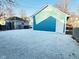 Blue garage with gravel surrounding it, creating a low-maintenance backyard space at 424 S Parker Ave, Indianapolis, IN 46201