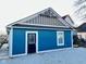 Beautiful blue garage with new gravel and exterior door; great for storing vehicles or outdoor equipment at 424 S Parker Ave, Indianapolis, IN 46201