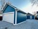 The garage has a modern white door, offering secure parking, plus extra storage space at 424 S Parker Ave, Indianapolis, IN 46201