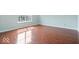 Bedroom with wood floors and a window at 4316 Village Trace Dr, Indianapolis, IN 46254