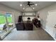Bright living room featuring high ceilings, a fireplace, and patio access at 4336 Bittersweet Ln, Greenwood, IN 46142