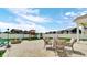 Open backyard with patio seating, fire pit, playground and fenced-in lawn at 4763 W Tradwell Dr, New Palestine, IN 46163