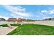 Well-maintained backyard with a playground and a lounge chair on a concrete patio at 4763 W Tradwell Dr, New Palestine, IN 46163