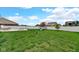 Large yard with patio, seating, playset, and firepit at 4763 W Tradwell Dr, New Palestine, IN 46163