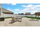Open patio with outdoor dining and lounge seating and fire pit at 4763 W Tradwell Dr, New Palestine, IN 46163