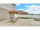 Backyard patio with seating area and umbrella, ideal for outdoor dining at 4763 W Tradwell Dr, New Palestine, IN 46163