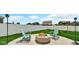 Relaxing backyard retreat with a fire pit and two Adirondack chairs at 4763 W Tradwell Dr, New Palestine, IN 46163