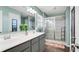 Stylish bathroom featuring double sinks, a glass-enclosed shower, and modern fixtures at 4763 W Tradwell Dr, New Palestine, IN 46163