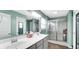 Beautiful bathroom featuring double sinks, elegant lighting, and a glass-enclosed shower at 4763 W Tradwell Dr, New Palestine, IN 46163