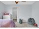 Bedroom showcasing a decorative ceiling fan and an adjoining walk-in closet at 4763 W Tradwell Dr, New Palestine, IN 46163