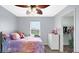 Bedroom with natural light, ceiling fan and a view of an organized closet at 4763 W Tradwell Dr, New Palestine, IN 46163