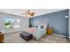 Serene bedroom with large window, soft carpet, and comfortable furnishings at 4763 W Tradwell Dr, New Palestine, IN 46163