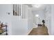 Inviting entryway with hardwood floors, white banister staircase, and decorative accents at 4763 W Tradwell Dr, New Palestine, IN 46163