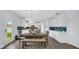 Bright eat-in kitchen features stainless appliances, decorative lighting, and a door leading to the backyard at 4763 W Tradwell Dr, New Palestine, IN 46163