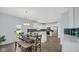 Bright eat-in kitchen features stainless appliances, decorative lighting, and a door leading to the backyard at 4763 W Tradwell Dr, New Palestine, IN 46163