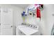 Laundry room featuring a front-load washer and dryer, shelf storage, and white walls at 4763 W Tradwell Dr, New Palestine, IN 46163