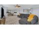 Open-concept home features a spacious living room that flows into a bright kitchen with stainless appliances at 4763 W Tradwell Dr, New Palestine, IN 46163