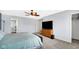 Spacious main bedroom featuring contemporary furniture and a view of a spa-like ensuite bathroom at 4763 W Tradwell Dr, New Palestine, IN 46163