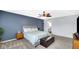 Comfortable main bedroom features ceiling fan, stylish furniture, and modern dresser at 4763 W Tradwell Dr, New Palestine, IN 46163