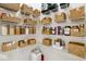 Well-organized pantry featuring white shelving, baskets, and clear containers for optimal kitchen storage at 4763 W Tradwell Dr, New Palestine, IN 46163