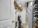 Utility room is equipped with a vacuum, water heater, and ample storage space, and shelving at 4763 W Tradwell Dr, New Palestine, IN 46163