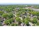 Drone shot of neighborhood showing houses and tree canopy on a sunny day at 5034 N Capitol Ave, Indianapolis, IN 46208