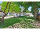 Beautiful backyard with mature trees, a detached garage, and well-maintained lawn at 5034 N Capitol Ave, Indianapolis, IN 46208