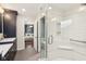 Clean bathroom featuring tiled shower and a view into an adjacent bedroom at 5034 N Capitol Ave, Indianapolis, IN 46208