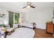 Well-lit bedroom with hardwood floors, white rug, and comfortable decor at 5034 N Capitol Ave, Indianapolis, IN 46208