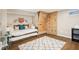 bedroom with a modern climbing wall, day bed, and a stylish area rug on the wood-look flooring at 5034 N Capitol Ave, Indianapolis, IN 46208