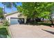 Spacious detached garage with a wide driveway and mature trees, offering ample parking at 5034 N Capitol Ave, Indianapolis, IN 46208