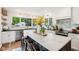 Bright kitchen with a large island, marble countertops, stainless steel appliances, and ample natural light at 5034 N Capitol Ave, Indianapolis, IN 46208