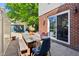 Outdoor patio with dining table and colorful chairs, ideal for entertaining guests at 5034 N Capitol Ave, Indianapolis, IN 46208
