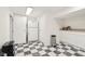 Storage room with black and white checkered floors, built-in cabinets, and ample space at 5034 N Capitol Ave, Indianapolis, IN 46208