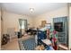 Bedroom with carpet floor, stacked storage bins and boxes, desk, and window at 540 Hanley St, Plainfield, IN 46168