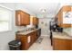 Functional kitchen with wooden cabinets, granite countertops, and black appliances at 540 Hanley St, Plainfield, IN 46168