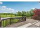 Large deck with wood railings overlooking a pond and green space, ideal for outdoor gatherings and relaxation at 542 Hadleigh Ct, Westfield, IN 46074