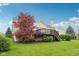 Expansive backyard featuring a wooden deck, lush lawn, and mature landscaping at 542 Hadleigh Ct, Westfield, IN 46074