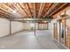Unfinished basement with exposed wood ceiling, concrete floor, and white painted walls offering a blank canvas for customization at 542 Hadleigh Ct, Westfield, IN 46074