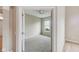 Carpeted bedroom with a window and ceiling fan, as seen from doorway at 542 Hadleigh Ct, Westfield, IN 46074