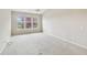 Bright bedroom with neutral walls, plush carpet, a ceiling fan, and a large window at 542 Hadleigh Ct, Westfield, IN 46074